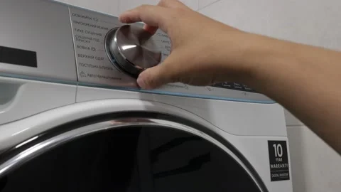 Setting Up The Drying Machine. Laundrying Clothes Laundry Room Drying Machine Video stock 202078268