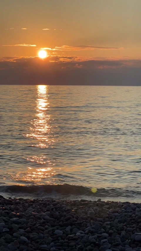 Setting evening sun over surface of water. Black Sea waves Stock Footage 280916528