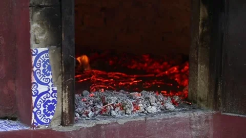 Setting fire in a clay oven with firewood Stock Footage 133751302