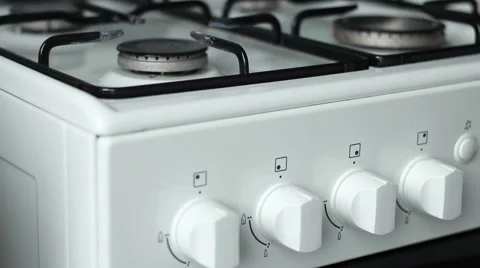 Setting fire to a gase stove with a handle lighter Stock Footage 63456546