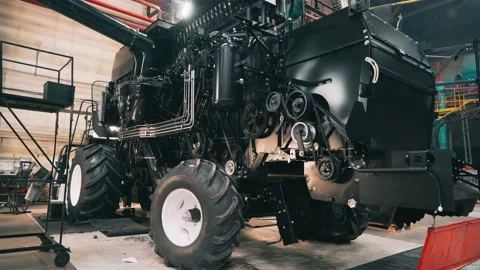 Setting up harvester in assembly shop, running in wheels and units of large Stock Footage 171766819