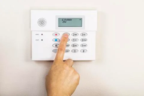 Setting home alarm system Stock Photos