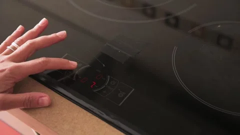 Setting Induction Cooktop Timer: Modern Kitchen Technology for Precise Cooking Stock Footage 319353791