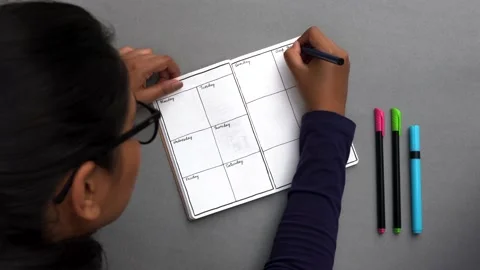 Setting up a journal with habit tracker, water intake etc 動画素材 147134976