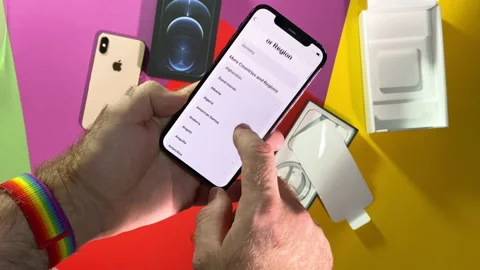 Setting language during POV unboxing  iPhone 12 Pro Stock Footage 142108657
