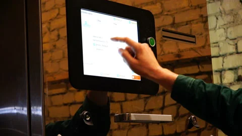 Setting up the machine using the touch screen monitor Stock Footage 92627883