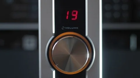 Setting master volume level on audio power amplifier wheel dial, 4K, stop motion Stock Footage 71127272