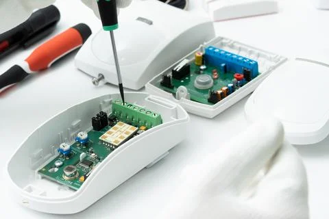 Setting up the motion sensor of security systems before installation. Stock Photos
