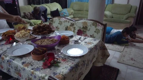 Setting New Year Eve table while children play, Crystal child Stock Footage 85462021