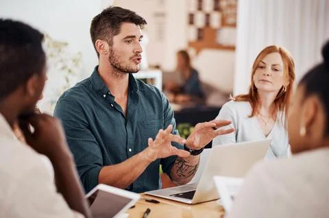 Setting out some clear objectives. Shot of a young businessman having a meeting Stock Photos