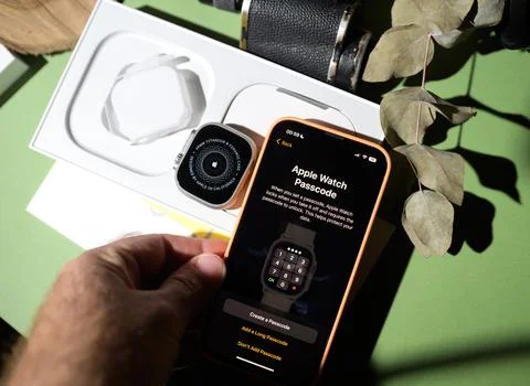 Setting the password passcode protection for new new titanium Apple Watch Ultra Foto stock