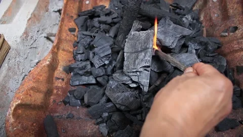 Setting a piece of wood to light coal  pollution 스톡 동영상 131664091