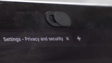 Setting - Privacy and security text. Hand sliding plastic to cover camera webcam Stock Footage 251944163