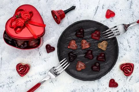 Setting for romantic dinner on white-grey background Stock Photos