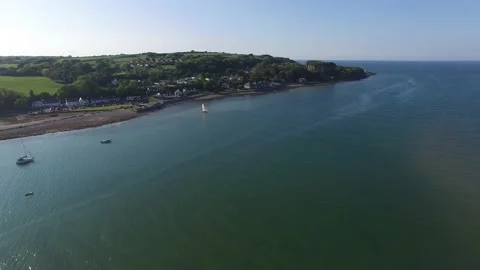 Setting sail on an Anglesey beach Stock Footage 234070217