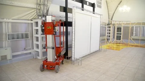 Setting up the scenery using a mobile lift Stock Footage 147444332