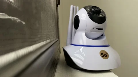 Setting up security camera indoor with white wall. Surveillance concept Stock Footage 224512025