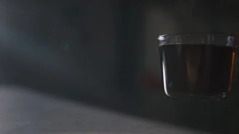 Setting steaming tea mug down in slow motion 動画素材 147672257