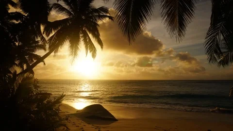 The setting sun against the Indian ocean in Seychelles 7 Stock Footage 112141506