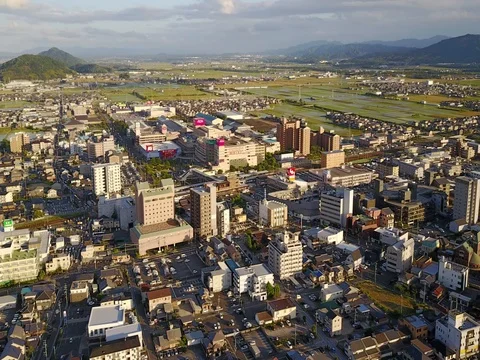 Setting Sun Casts Shadow Over Japanese Town 動画素材 80516469