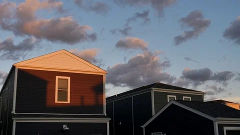 Setting Sun Casts a Shadow on a Suburban Home_B Video stock 79438639