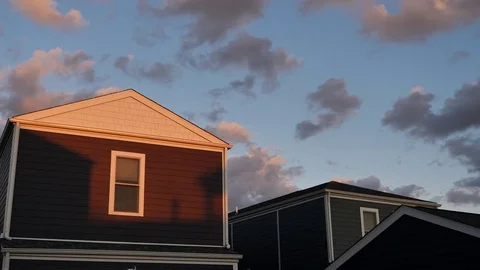 Setting Sun Casts a Shadow on a Suburban Home_A Video stock 79438699