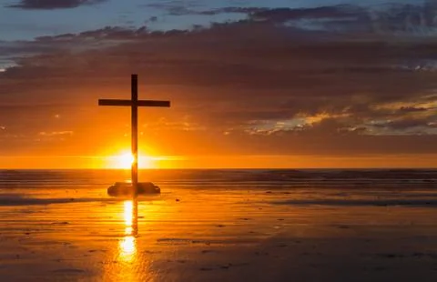 Setting sun cross Stock Photos