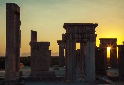 Setting Sun Glowing Through an Arch in Tachara Palace of Takht Jamshid Stock Photos
