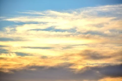 The setting sun illuminated the clouds with orange light.	 Stock Photos