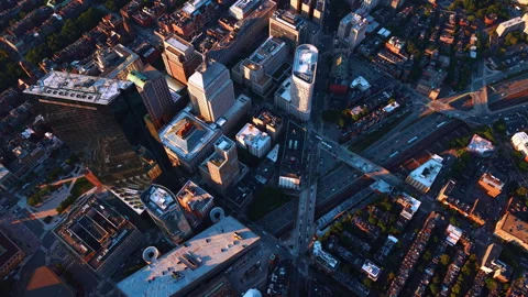 Setting sun lights the buildings in the urban landscape of modern lively city. Stock Footage 340477028