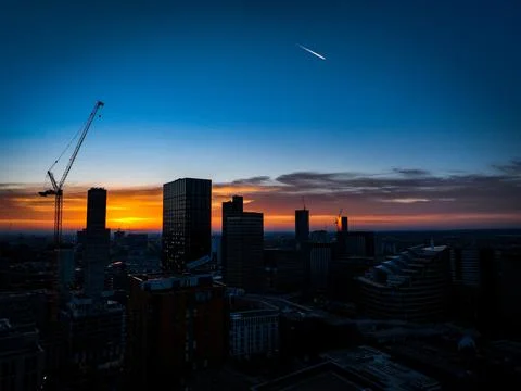 The Setting Sun in Manchester Stockfoto's