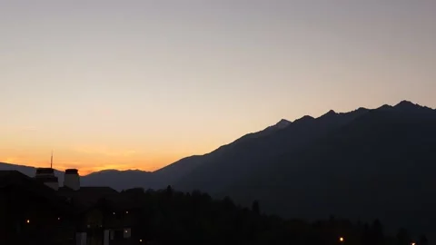 The setting sun in the mountains. Resort in a small village Stock Footage 158193858