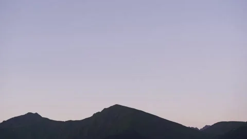 The setting sun in the mountains. Resort in a small village Stock Footage 158193878