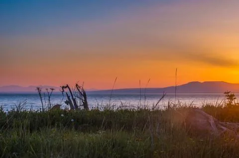 The setting sun over Alaskas Mount Susitna, locally known as The Sleeping Lady Stock Photos