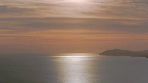 Setting Sun Over A Calm Ocean Stock Footage