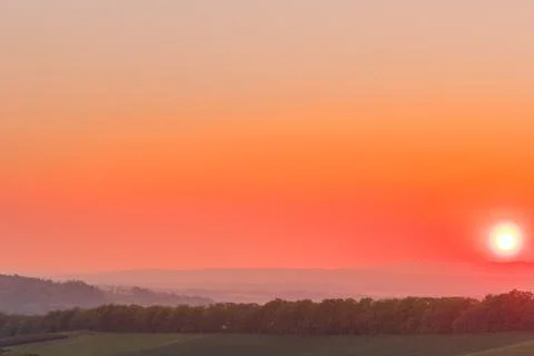 The setting sun over the forested mountain landscape of the Beskydy region, t Stock-Fotos