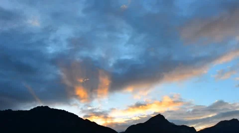 Setting sun painted the clouds in the grand color. Stock Footage 64992261