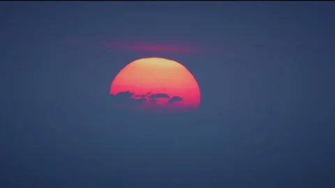 Setting Sun in Purple Color Dive in Dark Blue Haze Above Horizon Timelapse Stock Footage 130971385
