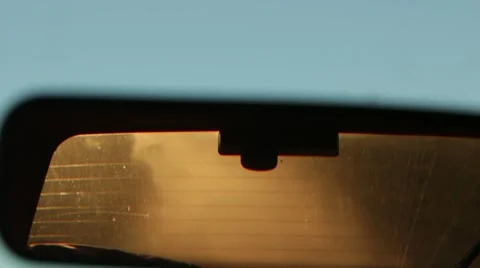 Setting sun in rear view mirror Video stock 60004553