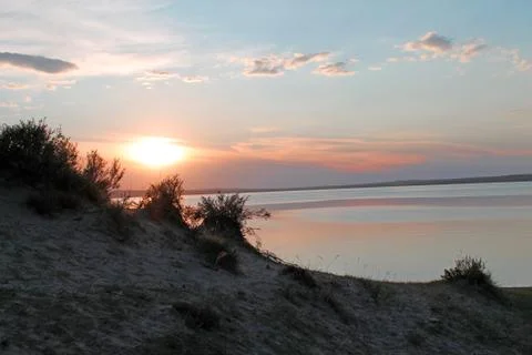 The setting sun reflected in the pond Stock Photos