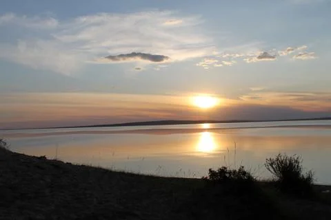 The setting sun reflected in the pond Stock Photos