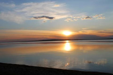 The setting sun reflected in the pond Stock Photos