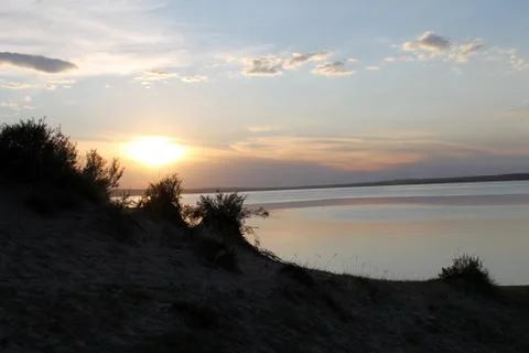 The setting sun reflected in the pond Stock Photos