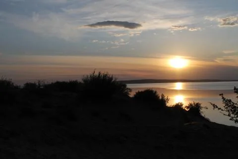 The setting sun reflected in the pond Stock Photos