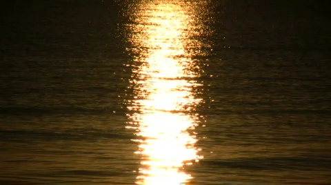 Setting sun is reflected in the rippling water (High Definition) Stock Footage 364814