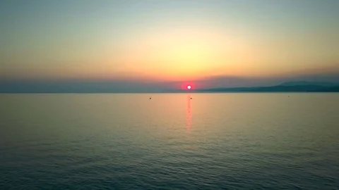 The setting sun is reflected in the sea waves. Sunset over sea. Stock Footage 115281311