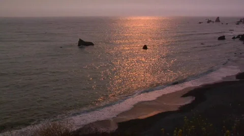 Setting Sun Reflecting in the Pacific Ocean on the West Coast Stock Footage 770980