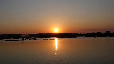 Setting Sun Reflects Over Water Stock Footage 77765865