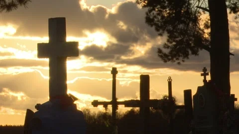 The setting sun, silhouettes of ancient stone crosses, timelapse Stock Footage 150257026