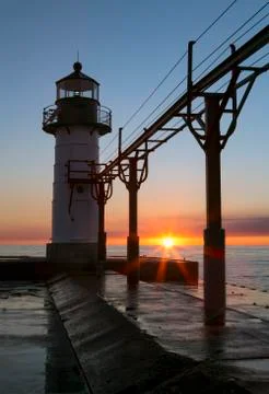 Setting Sun Silhouettes Lighthouse at St. Joseph Stock Photos